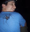 Kenneth Chapin with a whip spider on his back, in a cave in Puerto Rico in 2012.
