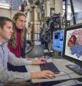 This photo shows Berkeley Lab scientists Eva Nogales and Robert Louder at the electron microscope.