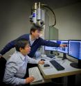 Gang Ren (standing) and Lei Zhang participated in a study at Berkeley Lab's Molecular Foundry that produced 3-D reproductions of individual samples of double-helix DNA segments attached to gold nanoparticles.