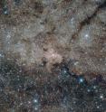 This infrared image from the NASA/ESA Hubble Space Telescope shows the centre of the Milky Way, 27,000 light-years away from Earth. Using the infrared capabilities of Hubble, astronomers were able to peer through the dust which normally obscures the view of this interesting region. At the center of this nuclear star cluster -- and also in the center of this image -- the Milky Way's supermassive black hole is located.