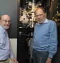 <p>Michael Rossmann (right), Purdue University's Hanley Distinguished Professor of Biological Sciences, and Richard Kuhn, director of the Purdue Institute for Inflammation, Immunology and Infectious Diseases, stand with the cryo-electron microscope used to determine the structure of the Zika virus.<p>A publication-quality photo is available at <a target="_blank"href="https://news.uns.purdue.edu/images/2016/kuhn-rossmann.jpg">https://news.uns.purdue.edu/images/2016/kuhn-rossmann.jpg</a>