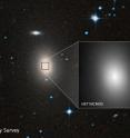 A sky survey image of the massive galaxy NGC 1600, and a Hubble Space Telescope closeup of the bright center of the galaxy where the 17-billion-solar-mass black hole -- or binary black hole -- resides.