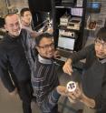 This is the research team at a probe station where they used simulated
sunlight to characterize electronic devices they'd made using a hybrid
nanomaterial (back to front: Chang-Yong Nam and Mircea Cotlet of
Brookhaven Lab&sup1;s Center for Functional Nanomaterials with Stony Brook
University graduate students Prahlad Routh and Jia-Shiang Chen).