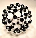Gevorg Grigoryan, an assistant professor of computer science at Dartmouth College, and his collaborators have created an artificial protein that self-organizes into a new material -- an atomically periodic lattice of buckminster fullerene molecules, or buckyball, a sphere-like molecule composed of 60 carbon atoms shaped like a soccer ball.