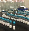 Vials containing microgel particles await analysis in the laboratory of Alberto Fernandez-Nieves at Georgia Tech. Researchers now believe they understand why oversized microgel particles spontaneously shrink to allow formation of colloidal crystals in assemblies of smaller microparticles.