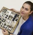 Dr. Nicole Gunter, invertebrate zoology collections manager at The Cleveland Museum of Natural History, is with dung beetle specimens in the collection.