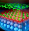 This is an illustration showing structure of Bi2Se3-EuS bilayer film. On the top layer the depth profile of the magnetization vector distribution of Eu atoms is represented by green arrows. The light purple spheres represent Bi2Se3 interfacial layers magnetized in close proximity to EuS FMI.