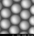 These glass spheres -- which are smaller than a human red blood cell -- organized themselves into a hexagonal pattern through self-assembly, as is shown in this scanning electron microscope image.