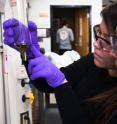 Students Karen Vallejo (background) and Ashley Garcia (foreground) examine triclosan extracts from plant tissues.