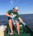 LSU doctoral candidate Michael Henson collects samples in the Gulf of Mexico.