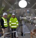 Engineers and scientists have designed a system to pump volcanic gases including carbon dioxide back into the earth, where the CO2 turns into a solid. Left to right, engineer Magnus Thor Arnarson, Lamont-Doherty Earth Observatory hydrologist Martin Stute and project leader Edda Sif Arradotir of Reykjavik Energy inspect the downgoing piping system.