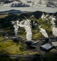 Air photograph of Reykjavik Energy's Hellisheidi geothermal power plant. The current emissions of the powerplant are: 40,000 tons CO2/year and 12,000 tons  H2S/year. The CarbFix I pilot CO2 injection site is connected to the powerplant via a pipeline that delivered some of the CO2 and H2S gases that were injected into a basaltic storage reservoir at ~500 m depth below surface.