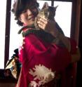 Researcher Saho Takagi holding her cat.