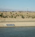 This image shows the California Aqueduct, with the Lost Hills Oil Field in the background.
