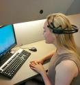 Jeanne Gallee, an undergraduate research assistant at the University of Washington's Institute for Learning & Brain Sciences, wears an EEG headset measuring her resting-state brain activity. Dr. Chantel Prat, whose research is sponsored by the Office of Naval Research, is studying how resting-state brain activity predicts language learning.