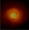 <p>An X-ray image reveals the hot plasma that envelopes the Perseus cluster. 

<p>Located some 240 million light years from earth, the Perseus cluster is one of the largest known structures in the universe.  The cluster includes not only the ordinary matter that makes up the galaxies, but an "atmosphere" of hot plasma with a temperature of tens of millions of degrees, as well as a halo of invisible dark matter. 

<p>Data from the Hitomi satellite reveals that although the black hole at the heart of the Perseus cluster has only one-thousandth of the mass of its host galaxy, and has a much smaller volume, it seems to have a huge influence on how the galaxy and how the surrounding hot plasma atmosphere evolve.