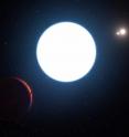 This artist's impression shows a view of the triple star system HD 131399 from close to the giant planet orbiting in the system. The planet is known as HD 131399Ab and appears at the lower-left of the picture.