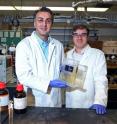 Amin Salehi-Khojin, UIC assistant professor of mechanical and industrial engineering (left), and postdoctoral researcher Mohammad Asadi with their breakthrough solar cell that converts atmospheric carbon dioxide directly into syngas.