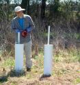Wes Childres, technician in the Soil Science Department at North Carolina State University, measuring well depth.