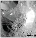 Dawn's Framing Camera looks down on the fractured summit of Ahuna Mons, tallest mountain on dwarf planet Ceres. The cracks on top suggest Ahuna grew by inflation: icy freezing water pushed up inside the mountain, making a dome. (This image and the following one have the same scale and orientation, and are taken from the <em>Science</em> paper.)