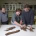 NIU's Reed Scherer (left to right), Mike Henderson and Joe Peterson examine Jane's upper jawbone at the Burpee Museum.