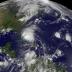 The GOES-13 satellite saw Hurricane Irene moving through the Bahamas on Aug. 25, 2011 at 1402 UTC (10:02 a.m. EDT) and far to the east was newly born Tropical Depression 10 (far left). Irene dwarfs Tropical Depression 10, and Irene is about 1/3 the size of the entire US East coast.