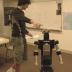 This images shows someone arguing with Robovie over the robot's mistake while playing a game.