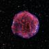 The Tycho supernova remnant is the result of a Type Ia supernova explosion. The explosion was observed by Danish astronomer Tycho Brahe in 1572. More than 400 years later, the ejecta from that explosion has expanded to fill a bubble 55 light-years across. In this image, low-energy X-rays (red) show expanding debris from the supernova explosion and high energy X-rays (blue) show the blast wave - a shell of extremely energetic electrons.