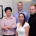 Members of Kan Wang's research team gather in a Hach Hall meeting area dedicated to the late Victor Lin of Iowa State University and the Ames Laboratory. From left to right are Wang, a professor of agronomy; Justin Valenstein, a doctoral student in chemistry; Susana Martin-Ortigosa, a post-doctoral research associate in Wang's lab; and Brian Trewyn, an associate scientist in chemistry.