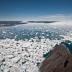 This is a view down the Ilulissat Fjord toward the terminus where Jakobshavn Isbrae rapidly discharges ice to the ocean.  This fjord is frequently clogged with icebergs along its entire 60-km  (37 mile) length.