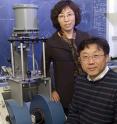 Yan Jin, University of Delaware professor of plant and soil sciences, and John Xiao, professor of physics and astronomy, with the magnetometer that was used to detect nanoparticles in the pumpkin plants in their study. UD photo by Kathy Atkinson