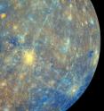 This is a mosaic of images collected by MESSENGER as it departed Mercury on October 6, 2008. The Wide Angle Camera on MESSENGER imaged the surface through 11 color filters ranging in wavelength from 430 to 1020 nm. A principal component analysis of the 11 sets of images helps to highlight subtle color differences. The second principal component, first principal component, and a ratio of the 430 nm to 1020 nm wavelengths are combined here in a red-green-blue composite.  
Impact craters that formed relatively recently, such as Kuiper (62 km in diameter, yellow crater near center), have contrasting ejecta and rays because they excavated fresh material. As it sits on the surface, this fresh crater material will gradually alter its color until it matches the background material. Other impact craters, such as those with ejecta that appear blue in this color scheme, have color contrasts because they excavated compositionally distinct material from below the surface.  Lermontov crater (152 km in diameter), near the top left, appears orange and is thought to contain pyroclastic deposits resulting from explosive volcanic activity in the past.