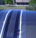 This is an exterior view of flexible solar strip designed by engineering researchers at McMaster on curved bus shelter roof.