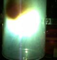 Lead rods, which are infused with the material to be encapsulated in hollow carbon molecules known as fullerenes, are blasted with a plasma arc. The resulting soot contains the filled carbon molecules. The remote-control process was invented to insert radio-labeled materials into fullerenes for use in diagnosing and treating tumors. Brain tumors are the target of the NIH-funded research being carried out by a Virginia Tech-Virginia Commonwealth University team.