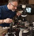 In his Johns Hopkins materials science lab, Professor Howard E. Katz adjusts probes used for testing electronic devices. In his Johns Hopkins materials science lab, Professor Howard E. Katz adjusts probes used for testing electronic devices.