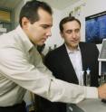 Biologist Benjamin Garcia (left) and chemical engineer Christodoulos Floudas collaborated to develop a fast and sensitive way to analyze proteins called histones, which play a key role in how genes function. Here, they load samples into a mass spectrometer, which separates and sequences hundreds of modified forms of histones. The work ultimately may aid the development of technology for reprogramming cells to fight cancer or to regenerate damaged tissue.