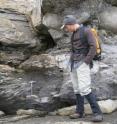 Lead author Noah Planavsky examines sedimentary rocks (diamictite) in Northern Norway that were deposited in the aftermath of one of the widespread 'Snowball Earth' glacial events.