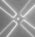 Scientists were able to trap a single particle between four microelectrodes, paving the way for a faster and cheaper way to sequence DNA.