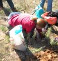 University of Oklahoma seismologist Katie Keranen (left) and Oklahoma State University geophysicist Estella Atekwana install a seismometer following a series of earlier quakes.