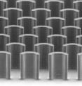 This scanning electron micrograph shows the micropillars embedded in the shearing blade used in the printing process. The pillars are 35 micrometers by 42 micrometers -- less than half the width of an average human hair in both directions -- and mix the organic semiconductor solution, ensuring it's evenly deposited.