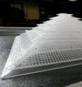 This is a close-up view of the 3-D acoustic cloak. The geometry of the plastic sheets and placement of the holes interacts with sound waves to make it appear as if it isn't there.