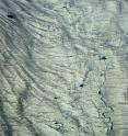 The surface of the Greenland Ice Sheet. A new study uses NASA data to provide the first detailed reconstruction of how the ice sheet and its many glaciers are changing. The research was led by University at Buffalo geologist Beata Csatho.